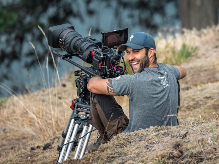 Tynan operating a camera in the field